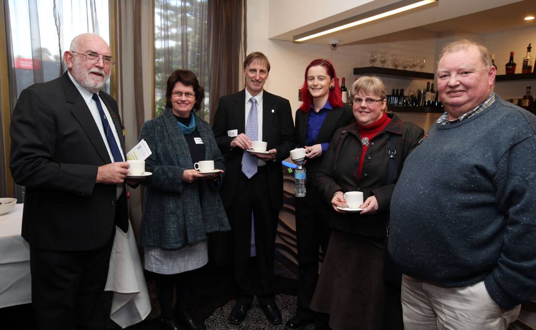  George Schmidt from Mildura, Anne Gleeson from Terang, Rob Ellison from Carnegie, Annabel Ellison from Carnegie, and Heather Addison and Neil Addison, both from Melbourne, share a cuppa and a chat at the Australian Rostrum Victoria Incorporated 80th Anniversary Dinner at Warrnambool’s Mid-City Motor Inn.