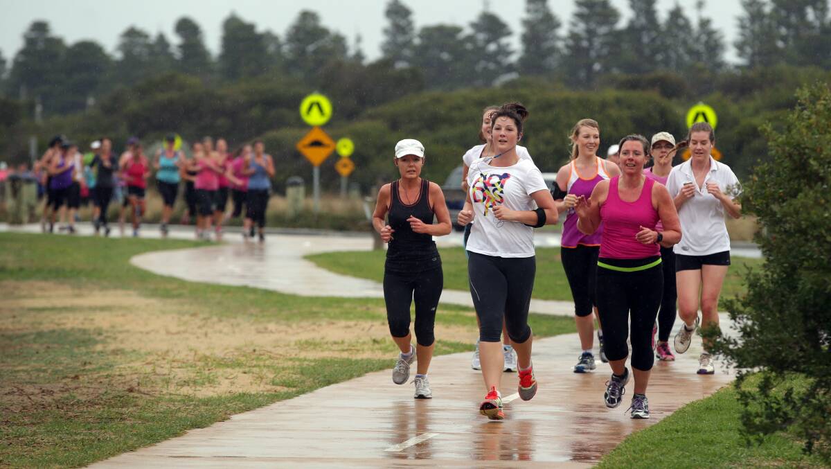 Runners splash along the Warrnambool’s foreshore promenade in the 8km and 4km runs during last year’s Mothers’ Day Classic. 