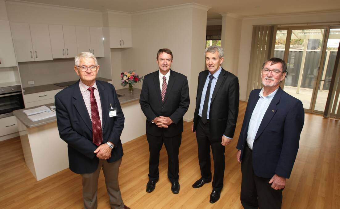 Timboon Abbeyfield chairman Peter Pope (left), member for Polwarth Terry Mulder, Corangamite Shire mayor Chris O’Connor and past Abbeyfield Society chief executive officer Doug Parker inspect the new unit at yesterday’s opening.150417AM06 Picture: ANGELA MILNE