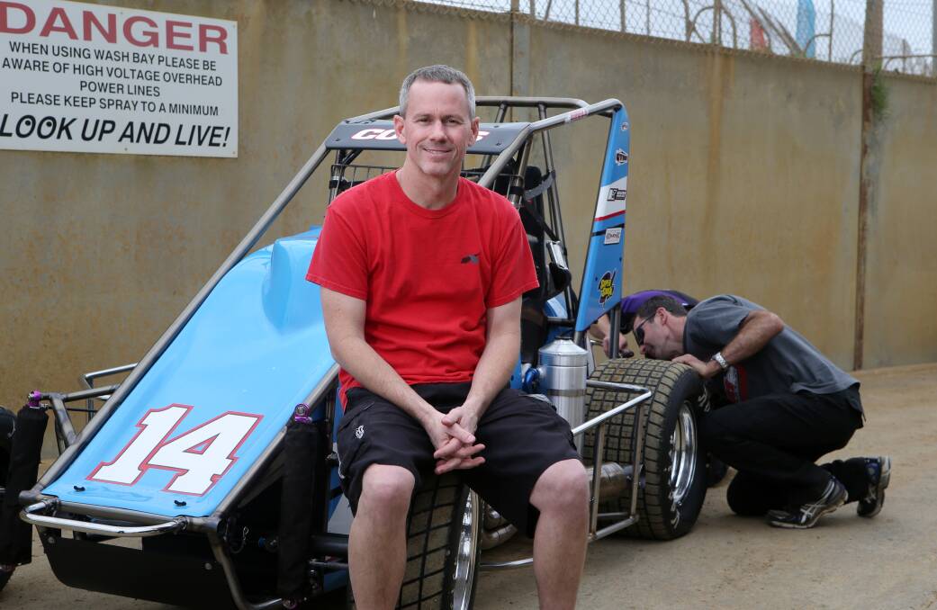 American Jerry Coons jnr relaxes as his crew prepares his car for this weekend’s Australian Speedcar Championship at Premier Speedway. 150225AS26 Picture: AARON SAWALL