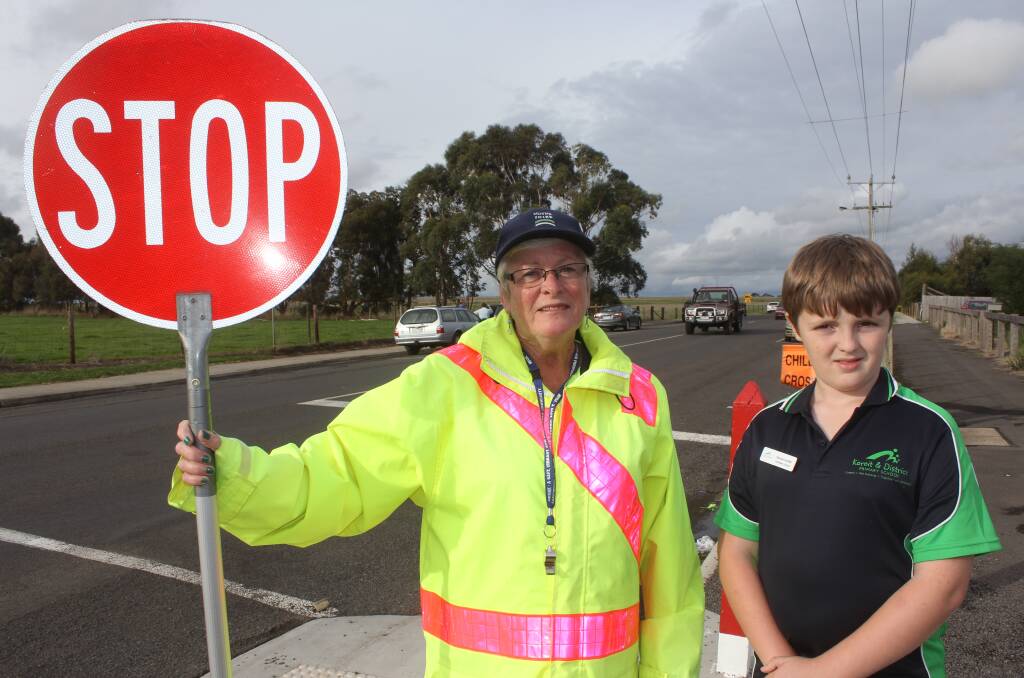 Crossing supervisor Sue Hand and Koroit and District Primary School pupil Samuel Sutcliffe who is campaigning to make the crossing safer.
                                                                140502AB01 Picture: ANTHONY BRADY