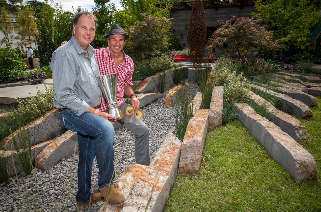 Bamstone managing director Michael Steel (left) and garden designer Mark Browning in his award-winning creation at the Melbourne International Flower and Garden Show.                                                                  Picture: Greg Sullavan
