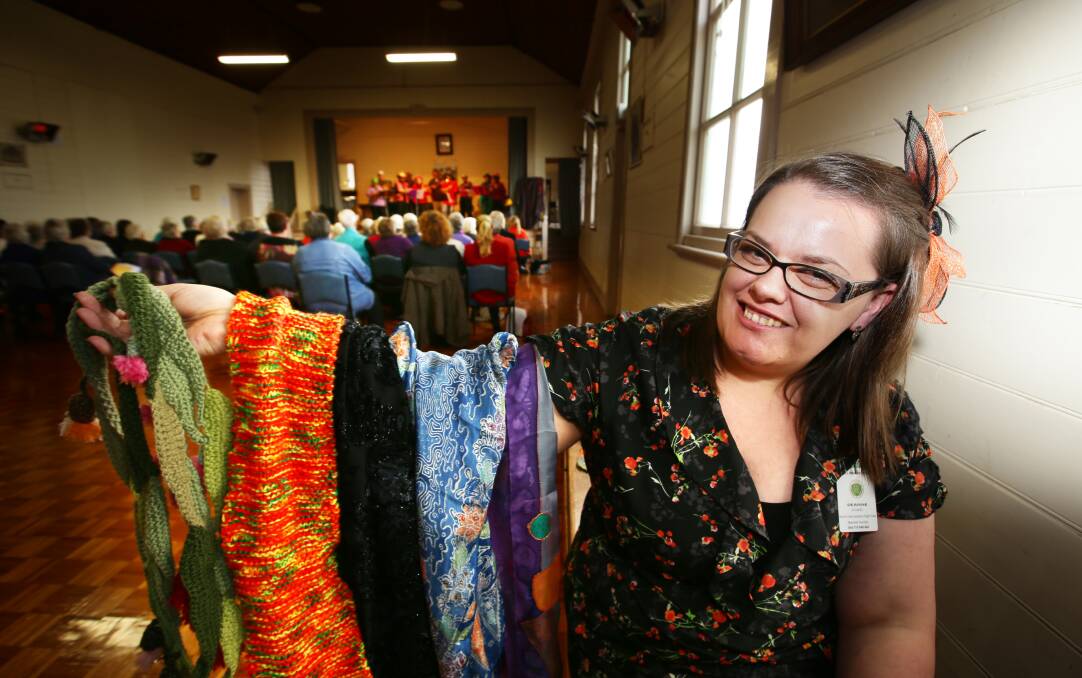 Deanne Evans, co-ordinator of yesterday’s CWA South Western Group social day at Allansford Hall, displays some of the scarves made by members she later had to judge.   
140620AM35   Picture: ANGELA MILNE