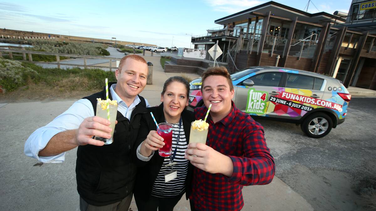 Toasting yesterday’s program launch with fairy floss and popcorn drinks were Fun4Kids Festival director Luke Cann (left) and team members Chloe Jewell and Nathan Holscher. 