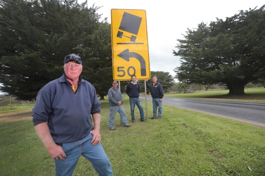Woorndoo residents Alan Wentworth (left), David Allen, Tom Wilson and Rod Leske are concerned about  the surface of a stretch of the Mortlake-Ararat Road near the township. 
141003VH08 Picture: VICKY HUGHSON
