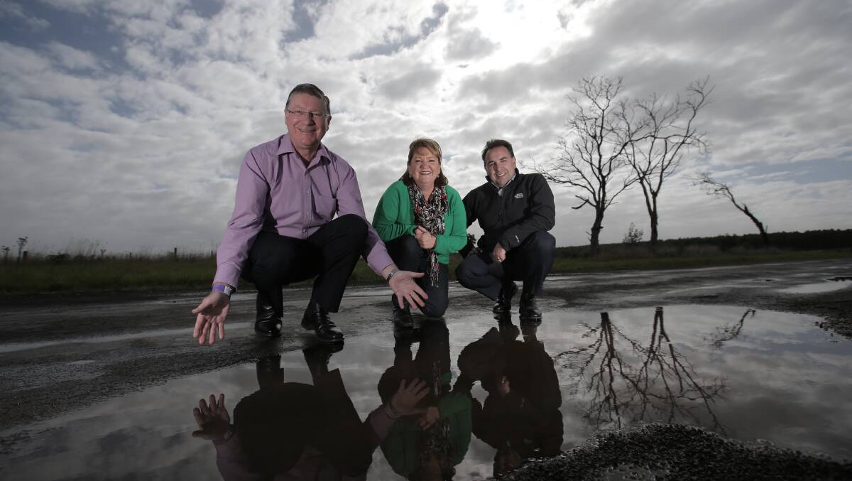 Premier Denis Napthine (left), with Roads to Ruin campaign director Jodi Fry and VicRoads regional director William Tieppo, reveals plans for a $5.3m upgrade to Heywood-Woolsthorpe Road. 
