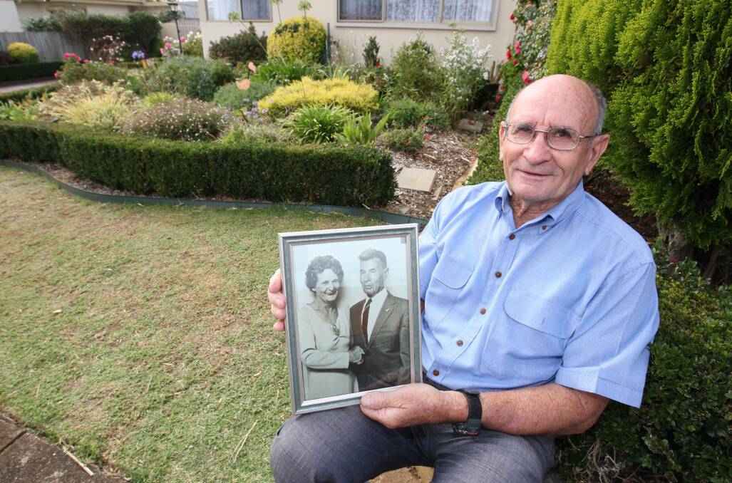 Warrnambool’s Mick Ray holding a photograph of his mother Laura and father Albert “Bert” Ray, who fought at Gallipoli as a teenager.