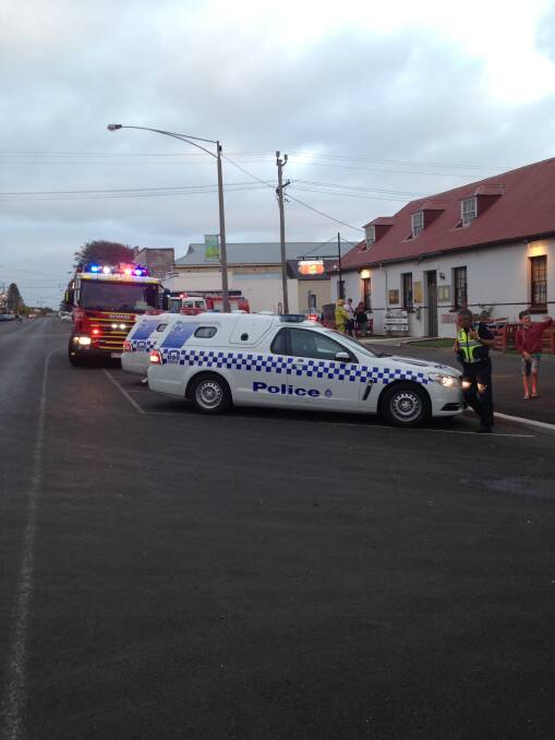 CFA and police vehicles outside The Stump at Port Fairy which was evacuated after smoke was detected last night