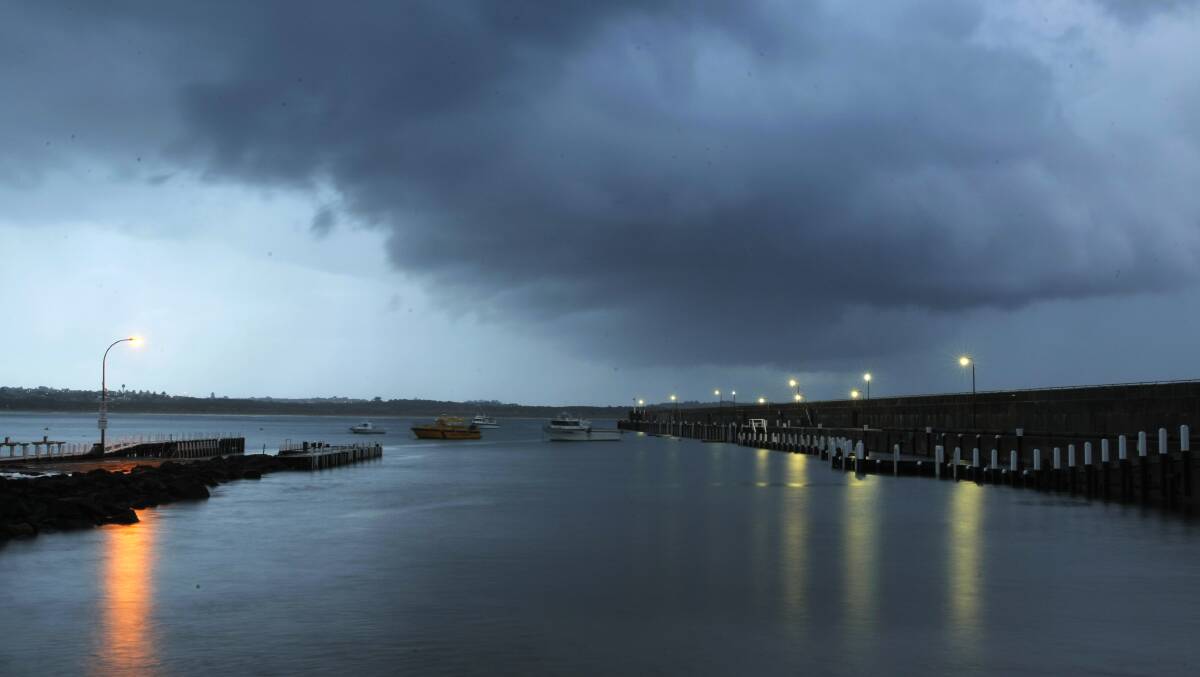 Storm clouds over the Breakwater and Lady Bay.  Picture: ROB GUNSTONE