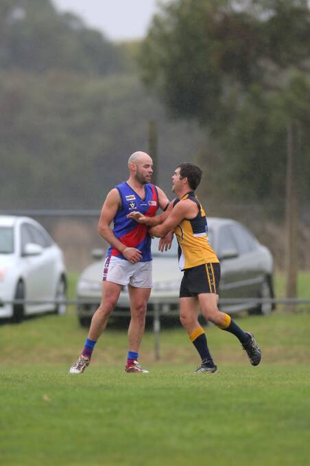 Terang Mortlake's Damian O'Connor (left) and North Warrnambool Eagles' Hank Schlaghecke square up on Saturday.
