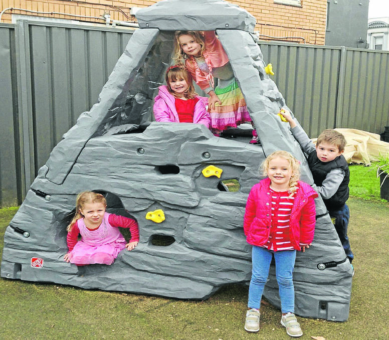 Children enjoy the new climbing pyramid at the Florence Collins Children’s Services complex in Warrnambool. 