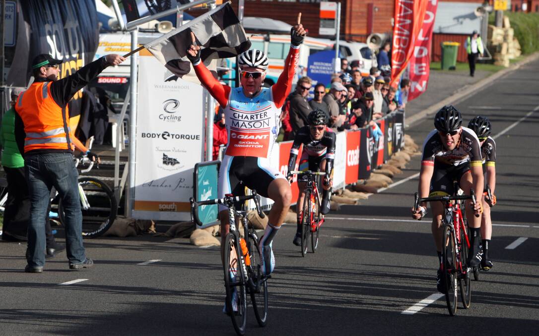 Tour of the South West criterium winner Raphael Freienstein celebrates at the finish line in Simpson Street.  Pictures: LEANNE PICKETT