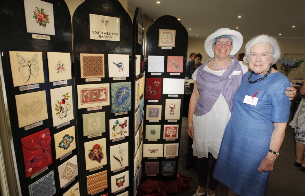 Victorian Embroiderers’ Guild south-west branch celebrated its 40th anniversary at Anchor Point community centre on Saturday where branch president Robyn Archer (left) and past president Susan Ewers inspected some of the group’s work.    141108AM81    Picture: ANGELA MILNE