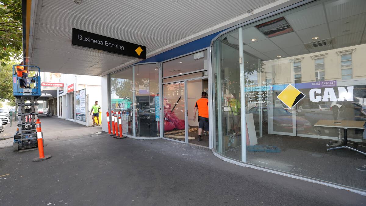Tradesmen put the finishing touches to the Commonwealth Bank’s new business centre located on Koroit Street, Warrnambool.  150310VH01 Picture: VICKY HUGHSON