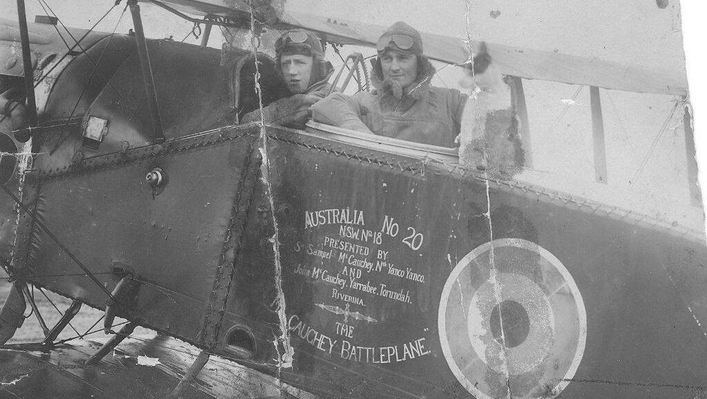 Pilot Paul McGinness (left) in a battle plane.