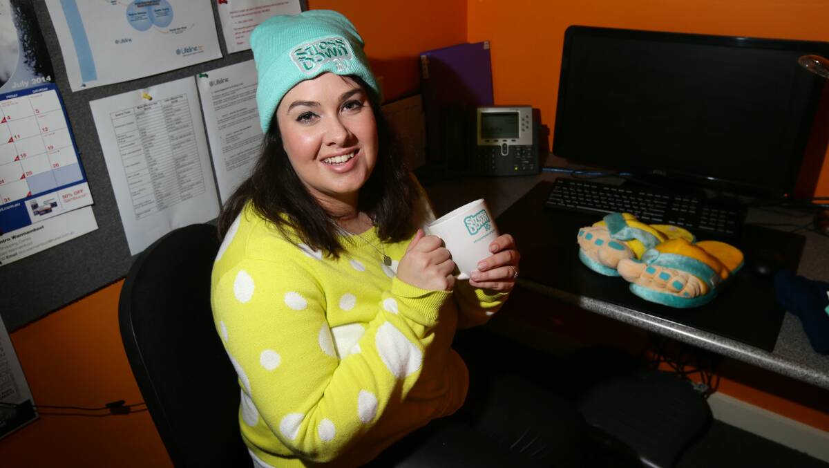 Lifeline’s Chloe Brian makes herself comfortable ahead of Friday’s Stress Down Day. 140711AS20 Picture: AARON SAWALL
