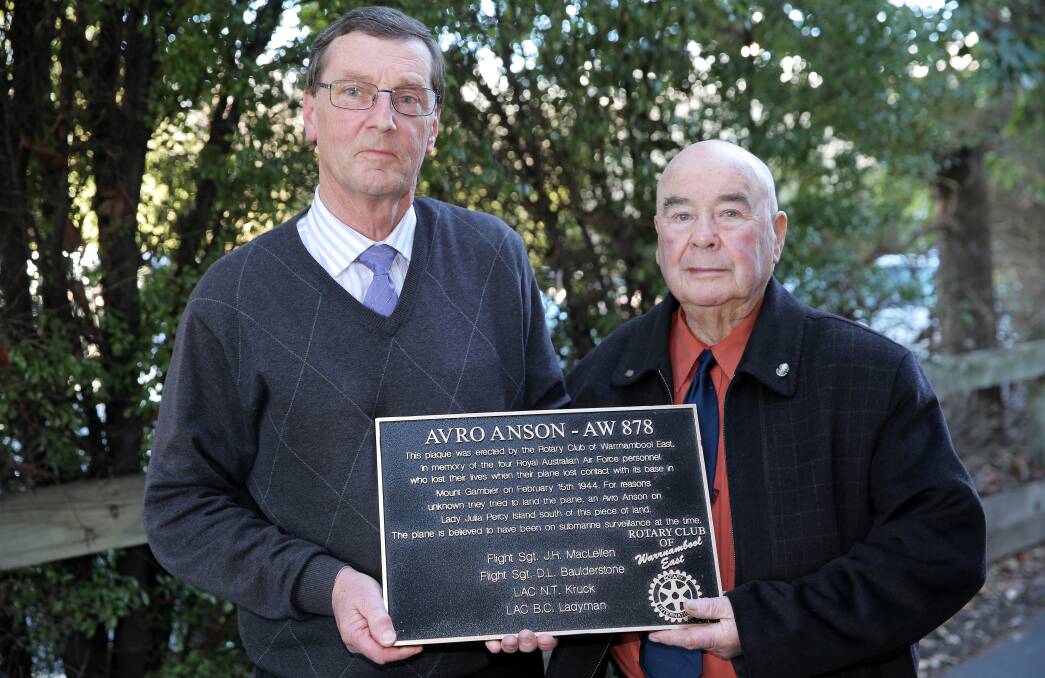 Roger Cussen (left) and Andrew Coffey, from the Rotary Club of Warrnambool East, with the plaque commemorating the crash of the Avro Anson AW-878. 140828RG19 Picture: ROB GUNSTONE