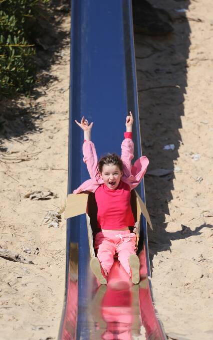 Kate McNeil, 6, enjoys the sun at the Yambuk slide. 140830VH41 Picture: VICKY HUGHSON