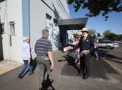 ALP candidate for South West Coast Roy Reekie hands out how-to-vote cards at the Temperance Hall in Warrnambool on Saturday. 141129LP03 Picture: LEANNE PICKETT