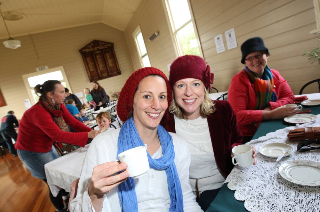Danielle Buzaglo (left) celebrates her birthday with a cuppa and biscuit, and Mel Ferrier, at the Kirky Bickie Bake-off. 