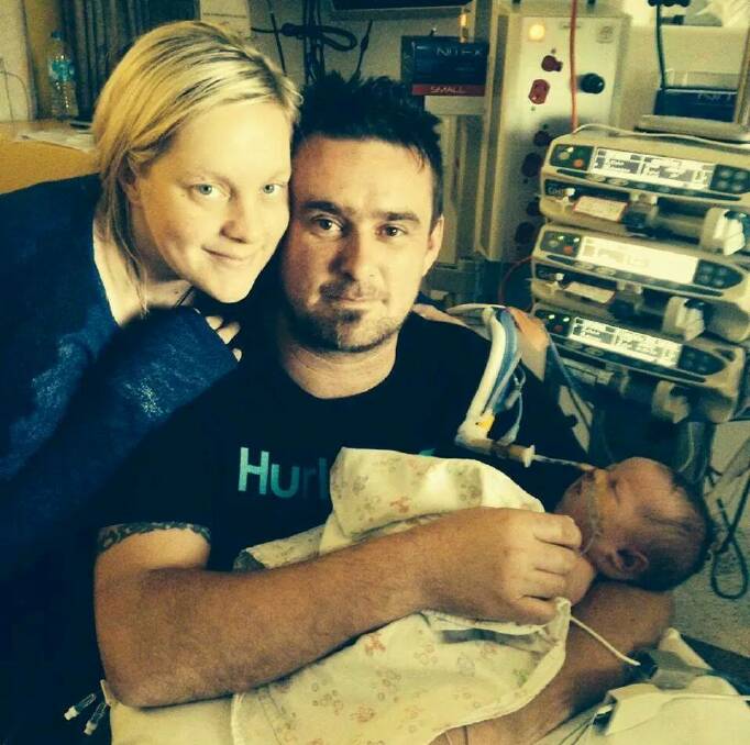 Erin Hurley and Adrian Billings with their daughter Harmony who was born with omphalocele.