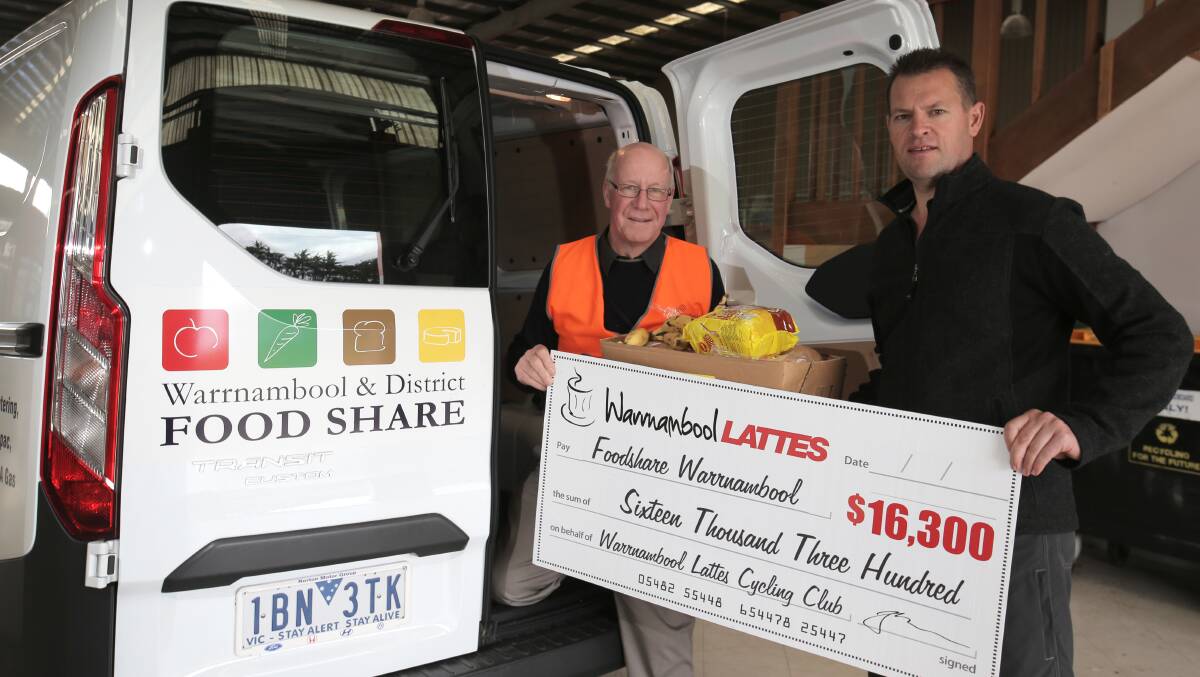 Warrnambool and District Food Share executive officer Dedy Friebe (left) receives a cheque from Warrnambool Lattes member Robert King as part of a donation that helped to pay for a new delivery van. 