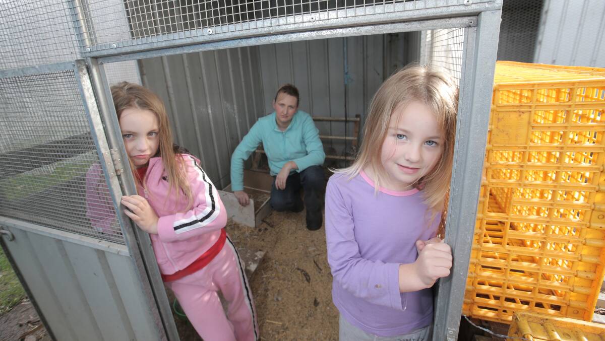 Talina Whittington, with her daughters Katelin, 8, (left) and Hayley, 5, after thieves stole all the chickens from their Koroit homestead on Friday night. 