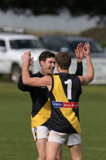 Jubilant Tigers Alister Porter (left) and Seamus Blake celebrate booking their side’s spot in the WDFNL grand final in a fortnight.140823AS29 Picture: AARON SAWALL