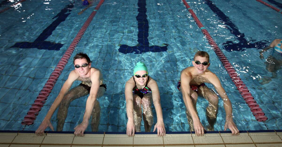 Jamin Baulch, 17, of Warrnambool (left), Nikki Nuske, 16, of Terang and Jason Pritchard, 14, of Warrnambool, take a breather at AquaZone before getting back into training for the weekend’s winter shortcourse competition. 