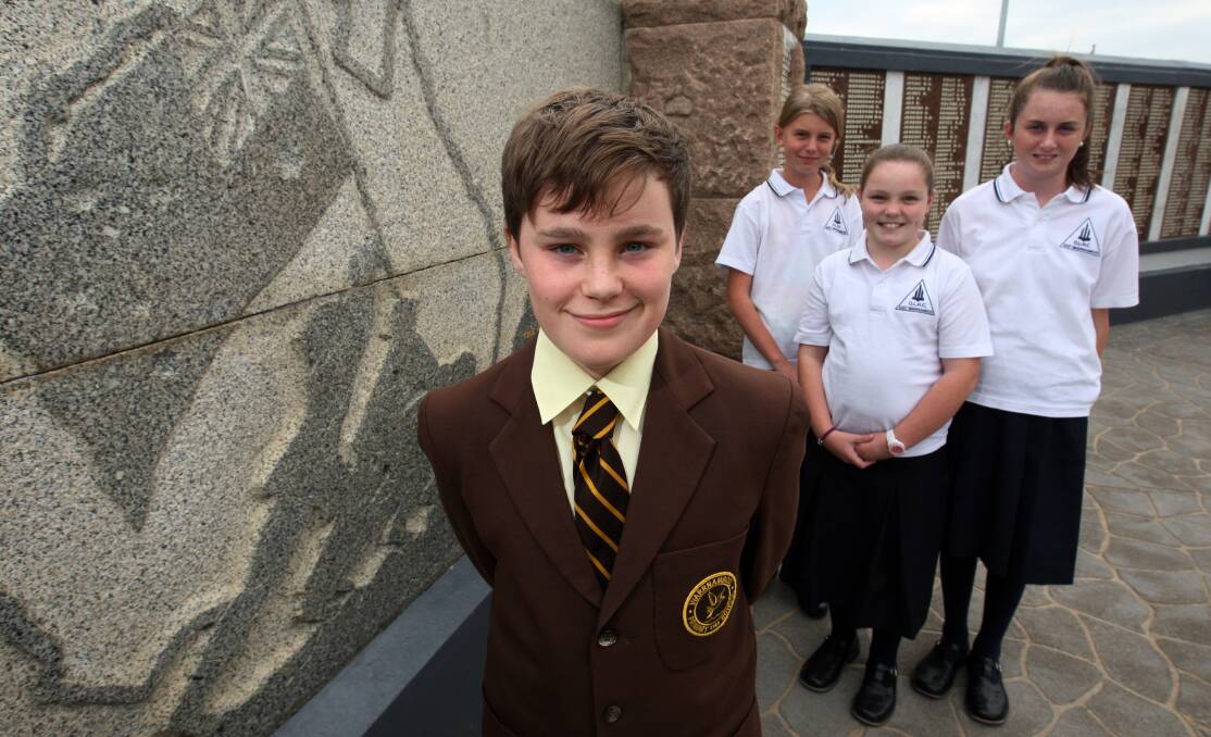 Warrnambool pupil Merrick McDonald (left), 12, Elle Kermond 12, Gemma Lake, 11, and Stephanie Jenkins, 12,  will read verses they have written about war at Anzac services.
 150417LP30 Picture: LEANNE PICKETT