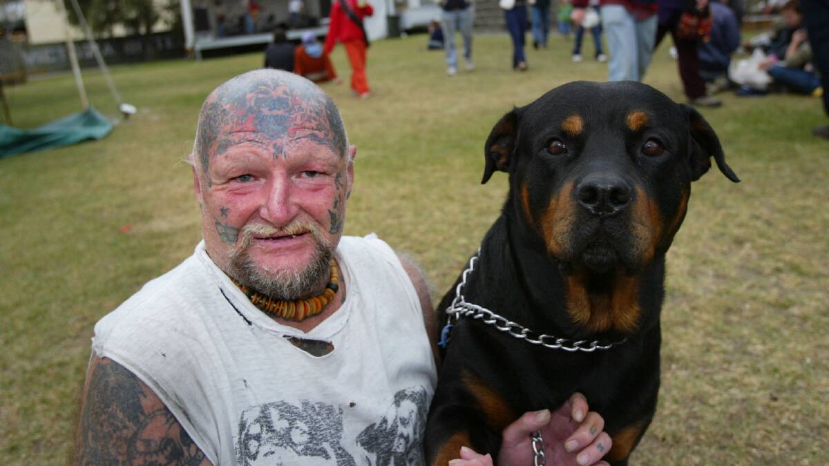 Port Fairy resident Tattoo Bob Shadlow with his dog Rocky at Fiddlers Green on the opening night of Port Fairy Folk Festival.