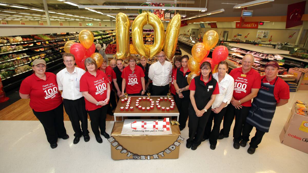 Warrnambool Centro Coles staff members celebrate 100 years of the company. Picture: DAMIAN WHITE