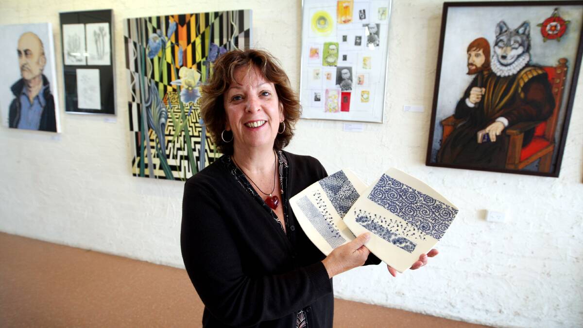 Emmanuel College creative arts co-ordinator Trudy Sharrock with her plates and other artwork from the teacher staff exhibition at Emmanuel College. 
Picture:LEANNE PICKETT