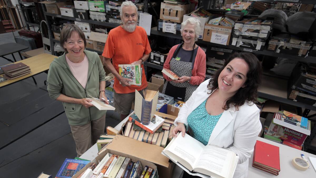 Lifeline volunteers Kate Silva, Clive Brownsea and Sandra Brownsea join community engagement manager Chloe Brian in sorting books for the Lifeline Book Fair.  They need more books and volunteers to get the event running. Picture: ROB GUNSTONE