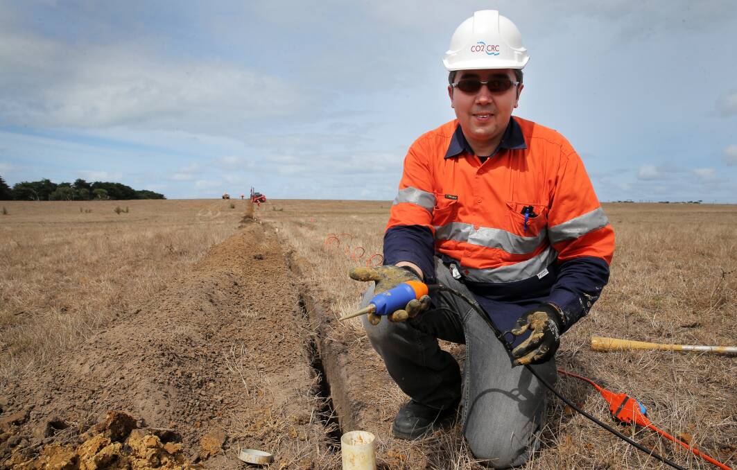Associate Professor Roman Pevzner, a geophysicist from Curtin University WA, installs geophones into the ground at Nirranda.