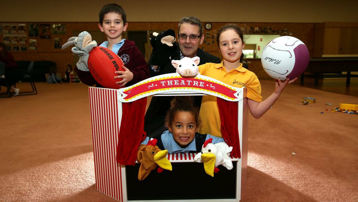 Warrnambool Telstra business centre manager Andrew Baudinette shares some fun with youngsters (from left) Will Matthews, 6, Safiyyah Gainey, 6, and Daveigh Brown, 10.