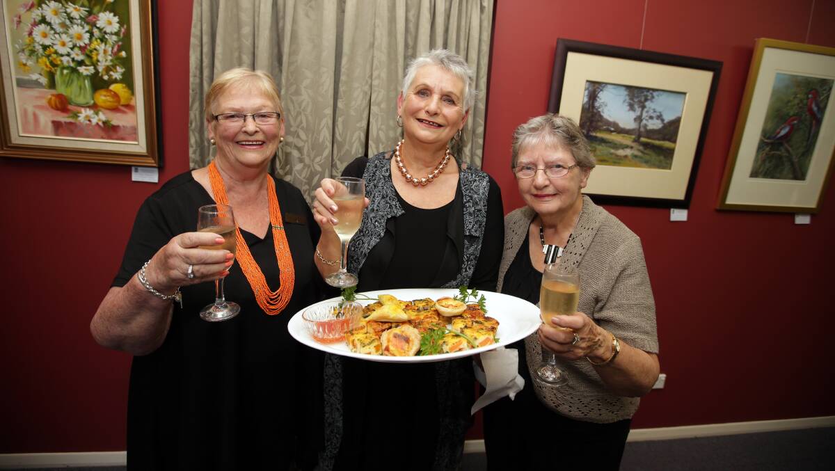 Warrnambool and District Artist Society president Maureen Healey and committee members Wilma Williams and Gwen Grayson at the annual Knife Fork and Brush dinner. Picture: DAMIAN WHITE