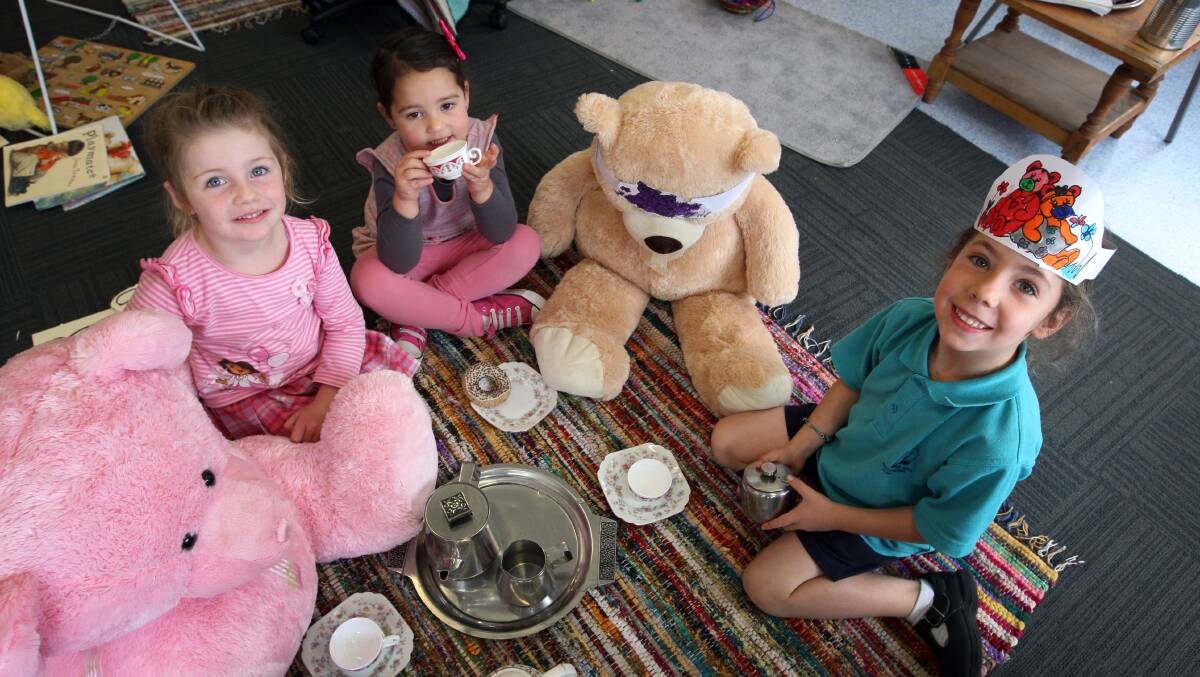 Mahogany Kindergarten children Victoria Lanyon,Ava Lee, 4, and Warrnambool West Primary School prep student Molly Hill, 5, share a teddy bear picnic.  Picture:LEANNE PICKETT