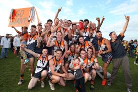 Dartmoor footballers celebrate winning the South West District Football Netball League grand final at Portland's Hanlon Park, after defeating Heywood. Picture: DAMIAN WHITE