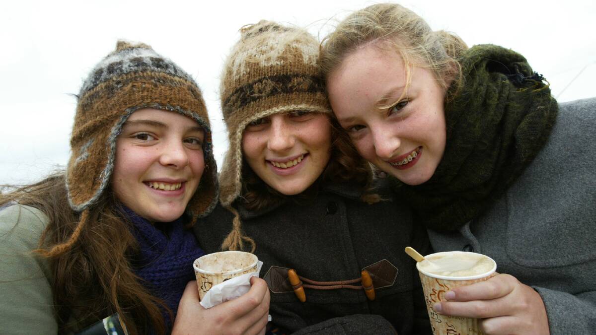 Francine Maas 15, Rebecca Rigby 14, and Katherine Strudwick 14 all from Melbourne try to keep warm with hot chocolates and warm clothes. 