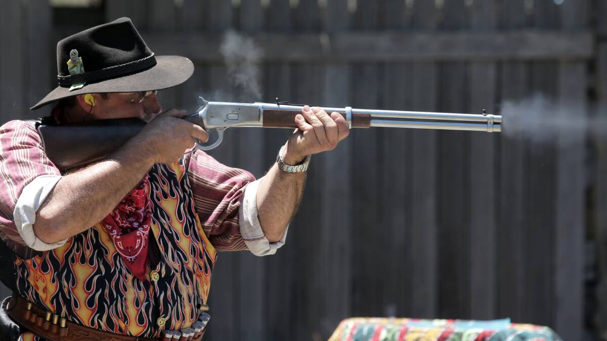 Geoff "Rus Ler" McLeod, of Grassmere, president of the Warrnambool Olympic Pistol Club, shows his skill with the replica Winchester Repeating rifle. 