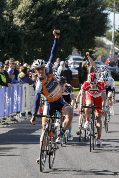 Anthony Giacoppo crosses the line and raises his fist in victory during the Tour of The Great South Coast in Port Fairy. Picture: ROB GUNSTONE