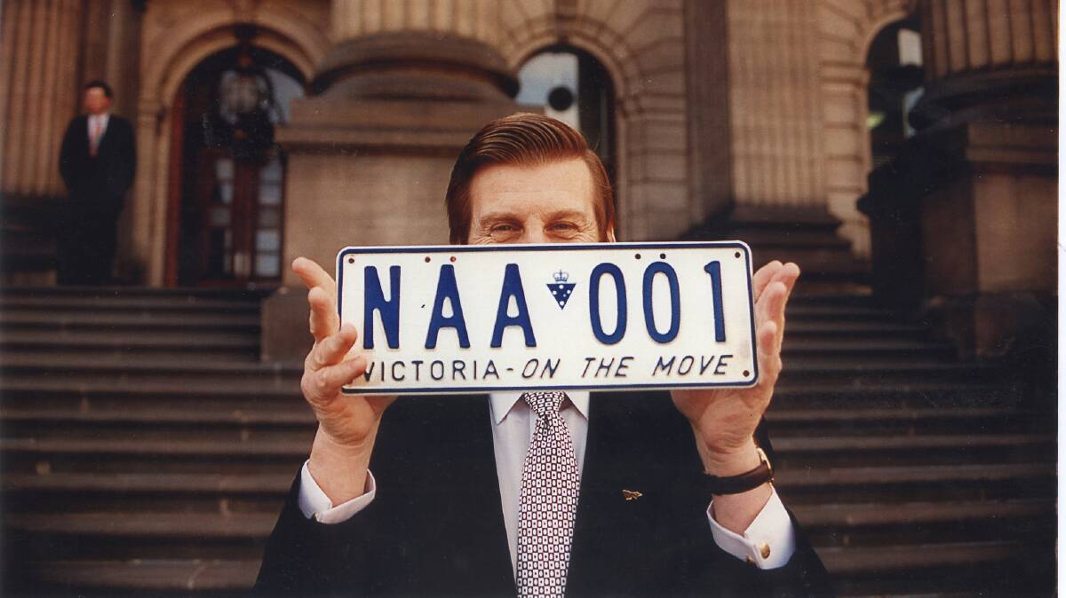 Victorian Premier Jeff Kennett shows off the state's new registration plates in 1996. Photo by Bruce Postle.