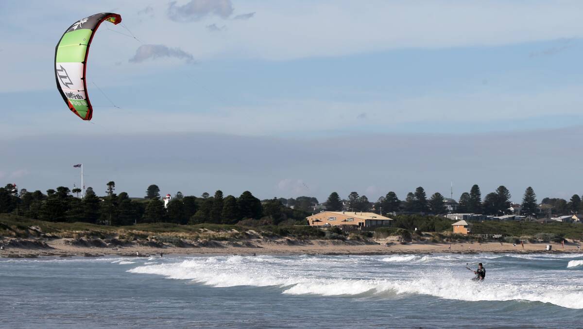 Kitesurfers play in the waves in Lady Bay, on a sunny Sunday afternoon in Warrnambool. Picture: ROB GUNSTONE
