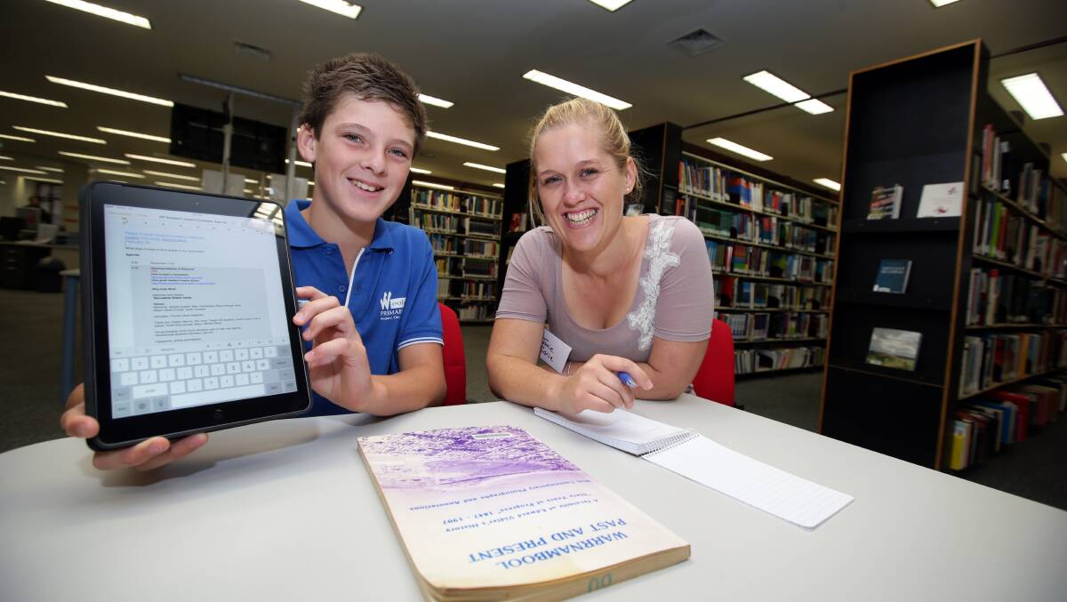 Woolsthorpe Primary School captain Riley Nicolson, 11, working with Deakin education in primary student Jamie Sorlie at the university's Peter's Project Students Leaders Forum for district primary schools. Picture: DAMIAN WHITE