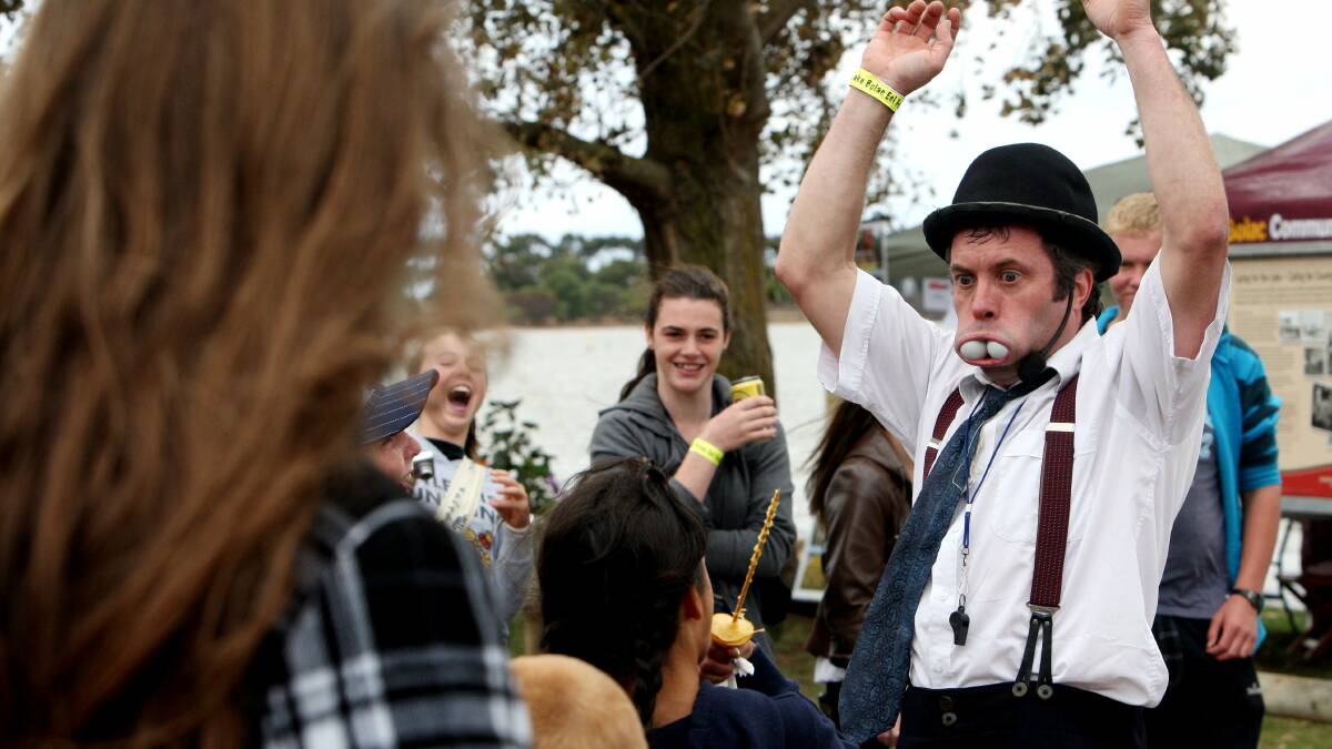 Street performer Justin McGinley in Lake Bolac at a past Eel Festival.