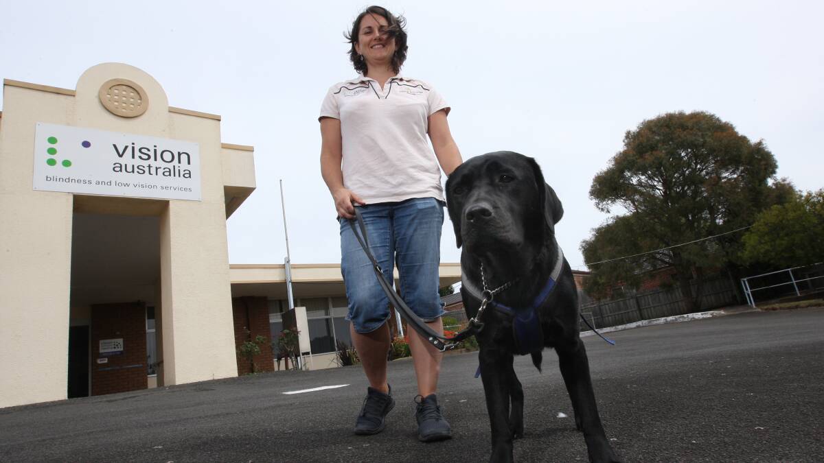 Seeing Eye Dogs Australia instructor Anna Gigliotti-Skret with Umali, a two-year-old Labrador Retriever.