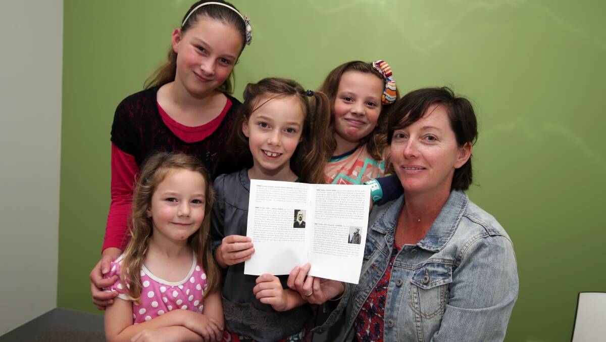 Rebecca Collins from Warrnambool with her children Grear, 5, Elsa, 11, Ava, 7, Halle, 9, holding a booklet about Private John Hance, who was Rebecca's great-great grandmother's brother. Picture: DAMIAN WHITE
