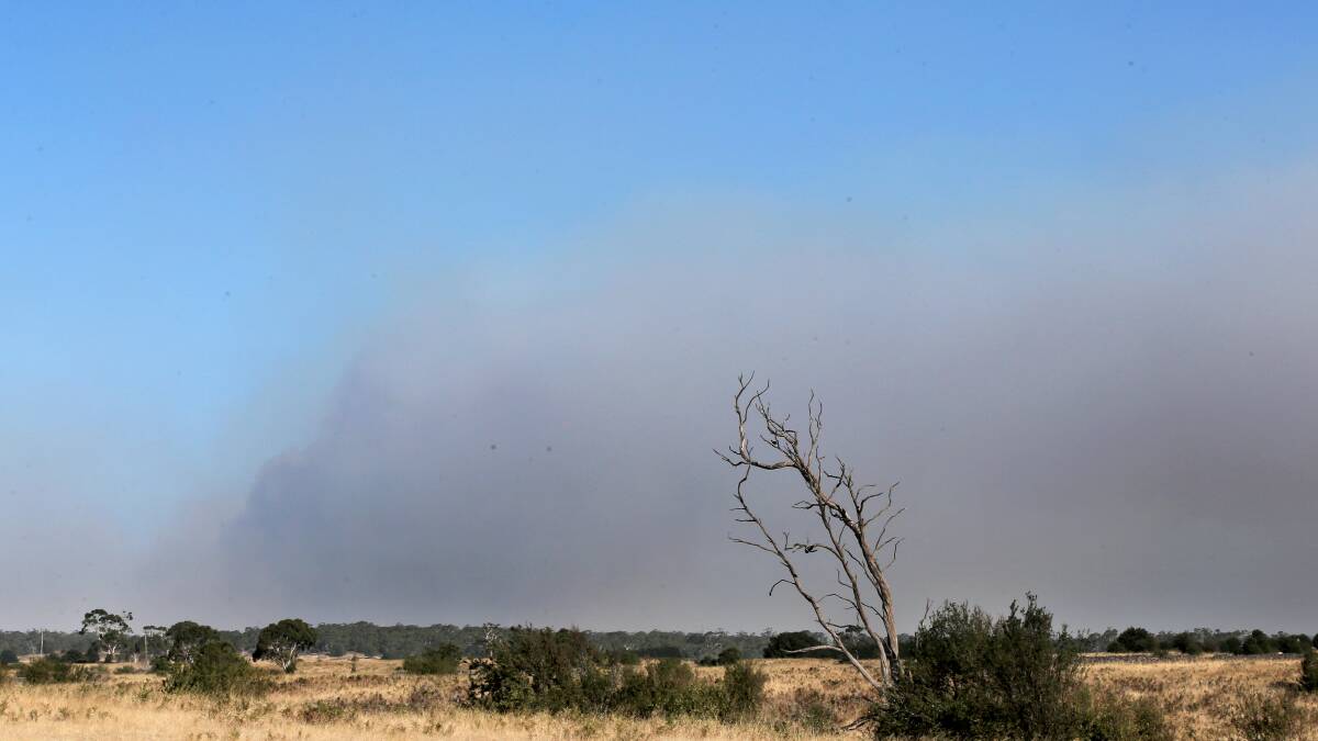 Smoke rises from the Stoneyford fire.
