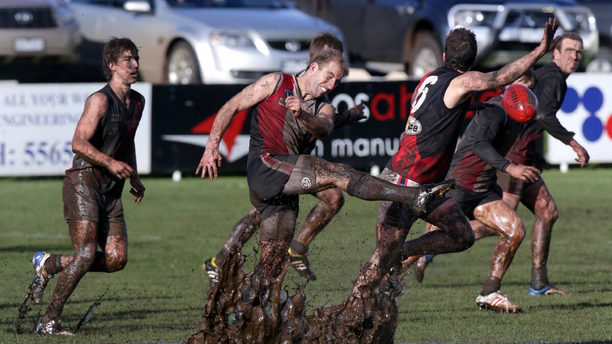 Koroit's Karl Dwyer gets a kick away at a soggy Victoria Park. Picture AARON SAWALL